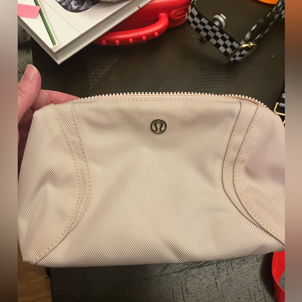 Lululemon make up bag, color is light pink.